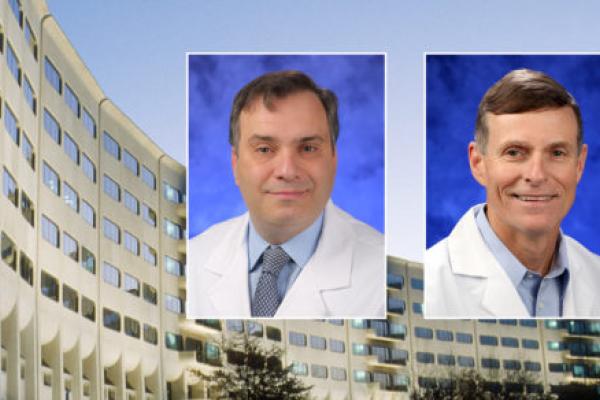 头和肩膀D博士专业的画像ino Ravnic and David Craft against a background image of Penn State College of Medicine.