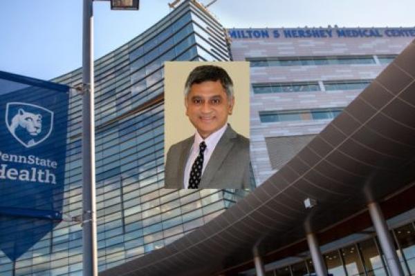 A portrait of Dr. Yatin Vyes is superimposed over an image of the exterior of Hershey Medical Center.