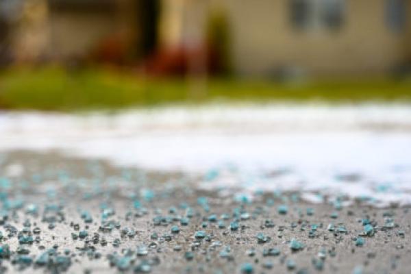 Close focused low angle view of salt, ice, and snow